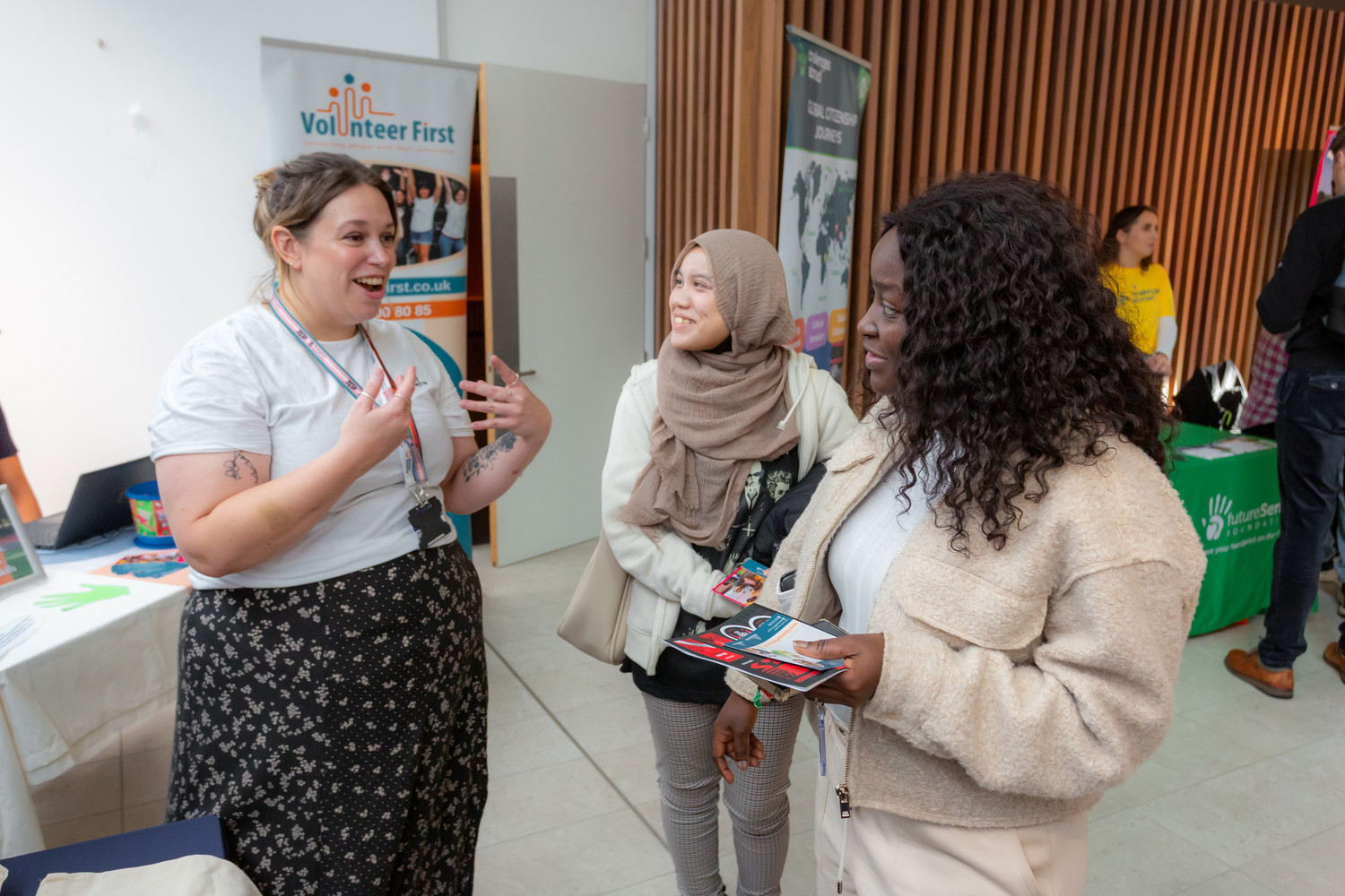 Students talk to an employer at a careers fair