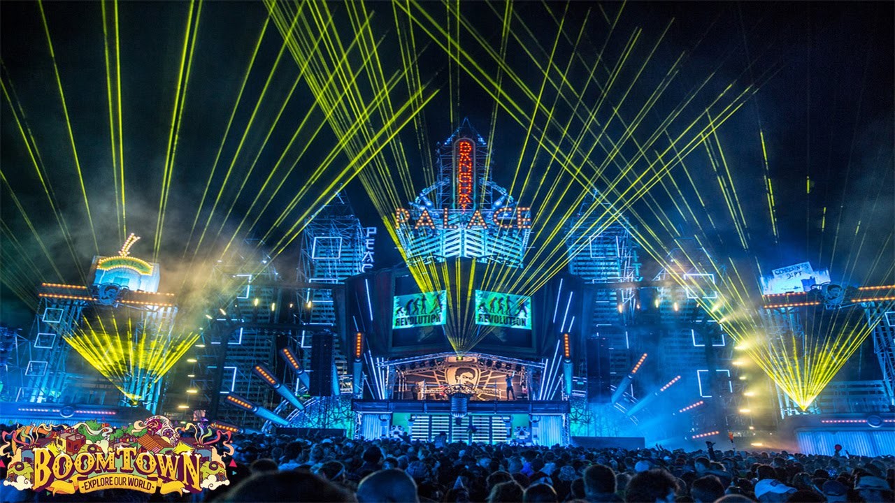 A wide angle shot of a vibrant night-time music festival