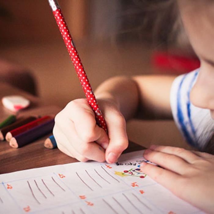 Teacher Development Department image of child writing