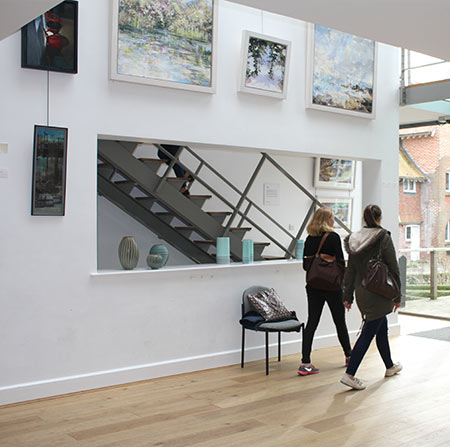 Students walking in the Link Gallery