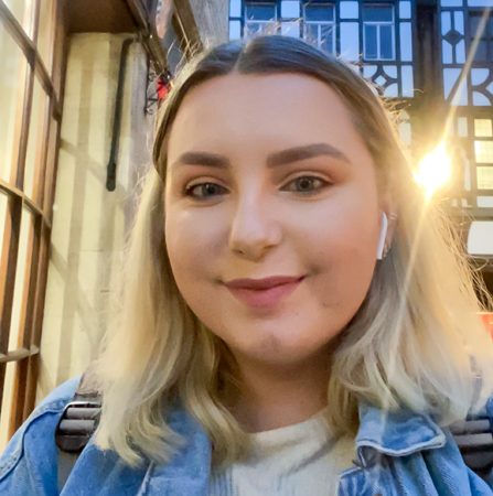 Female student on the high street at night