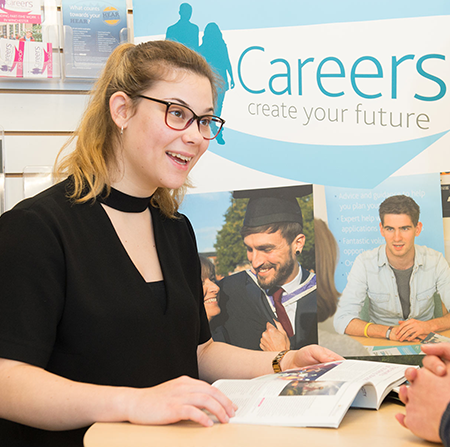 Student talking to a staff member