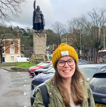 Female students standing in front of King Alfred statue