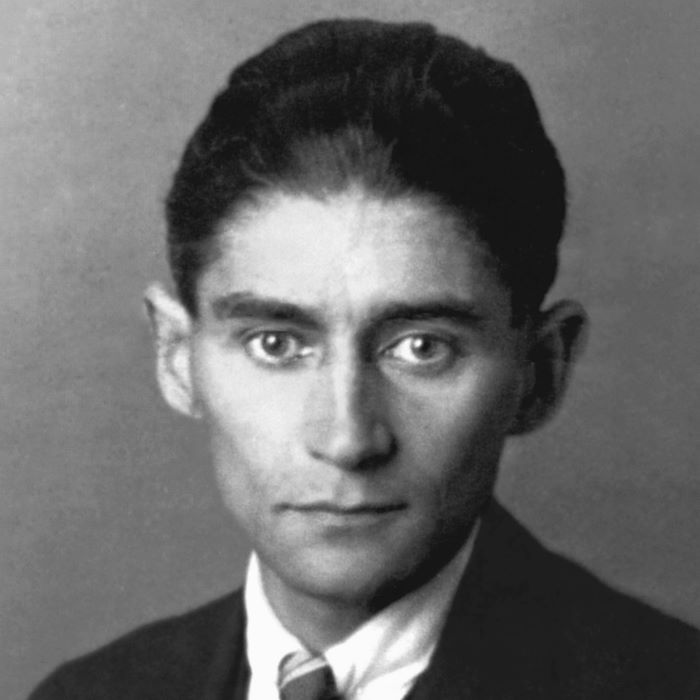 Black and white image of writer Franz Kafka - young man with dark hair and sharp features and a slightly haunted look.s