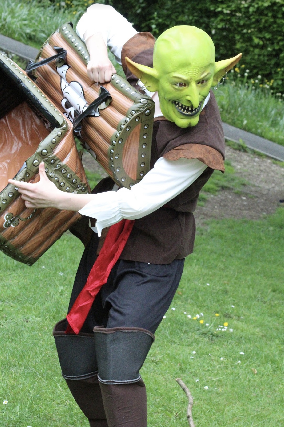Actor in green mask with long nose and flappy long ears