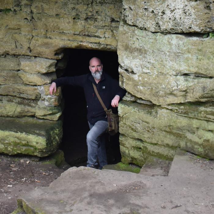 Man with statue of saint