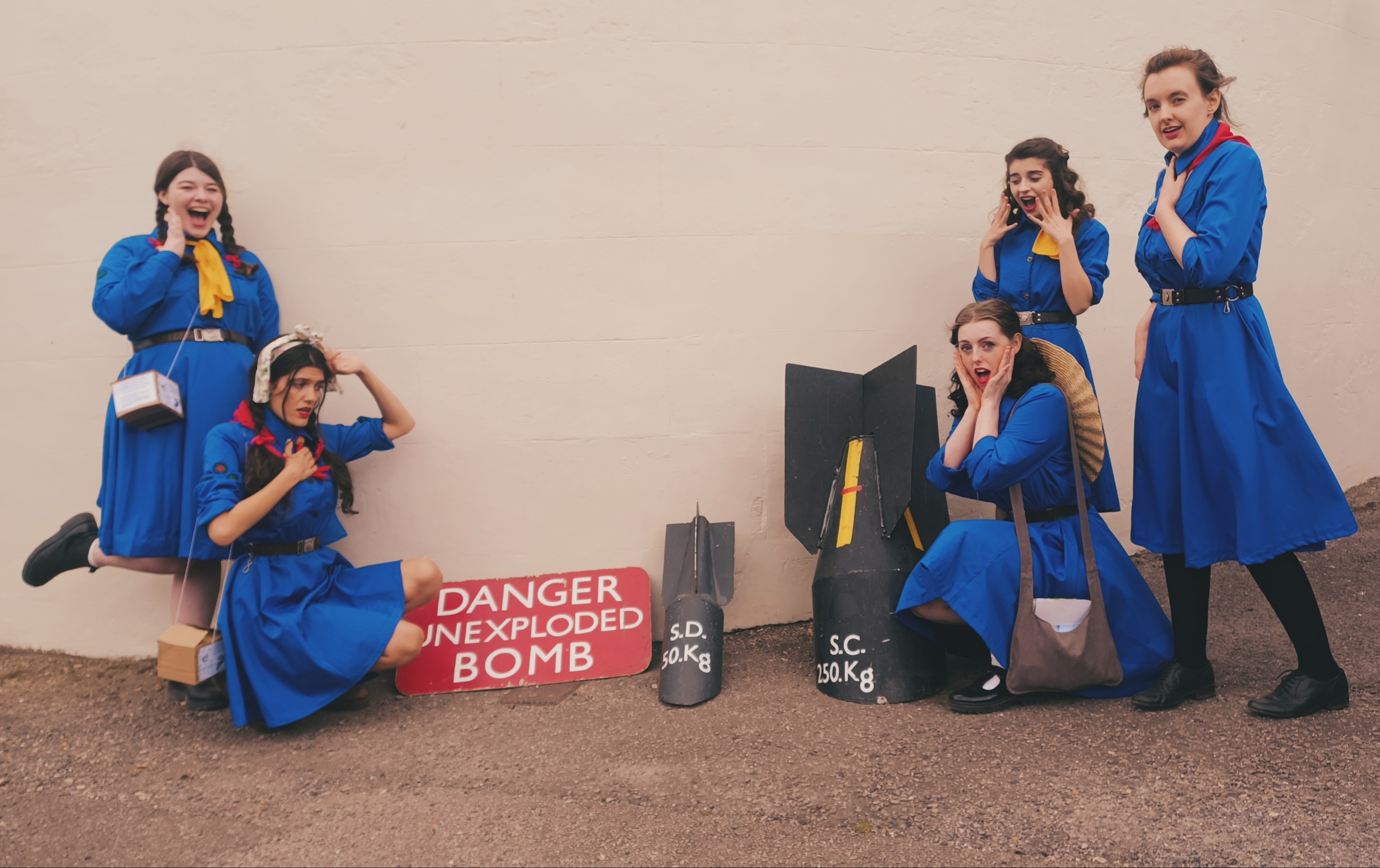 Girl Guides with two unexploded bombs
