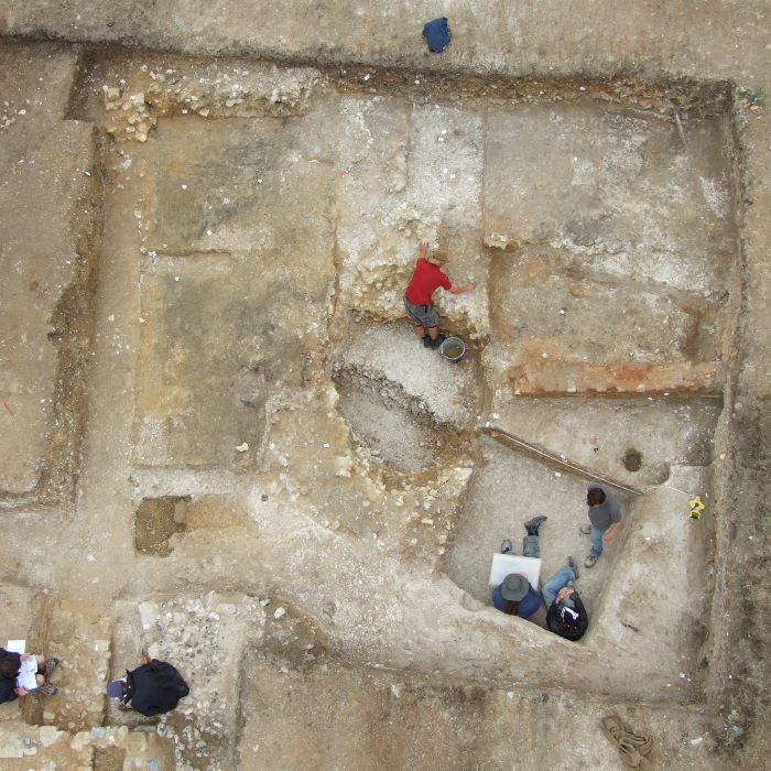 View from above of archaeological dig - outline of walls and rooms can bee seen
