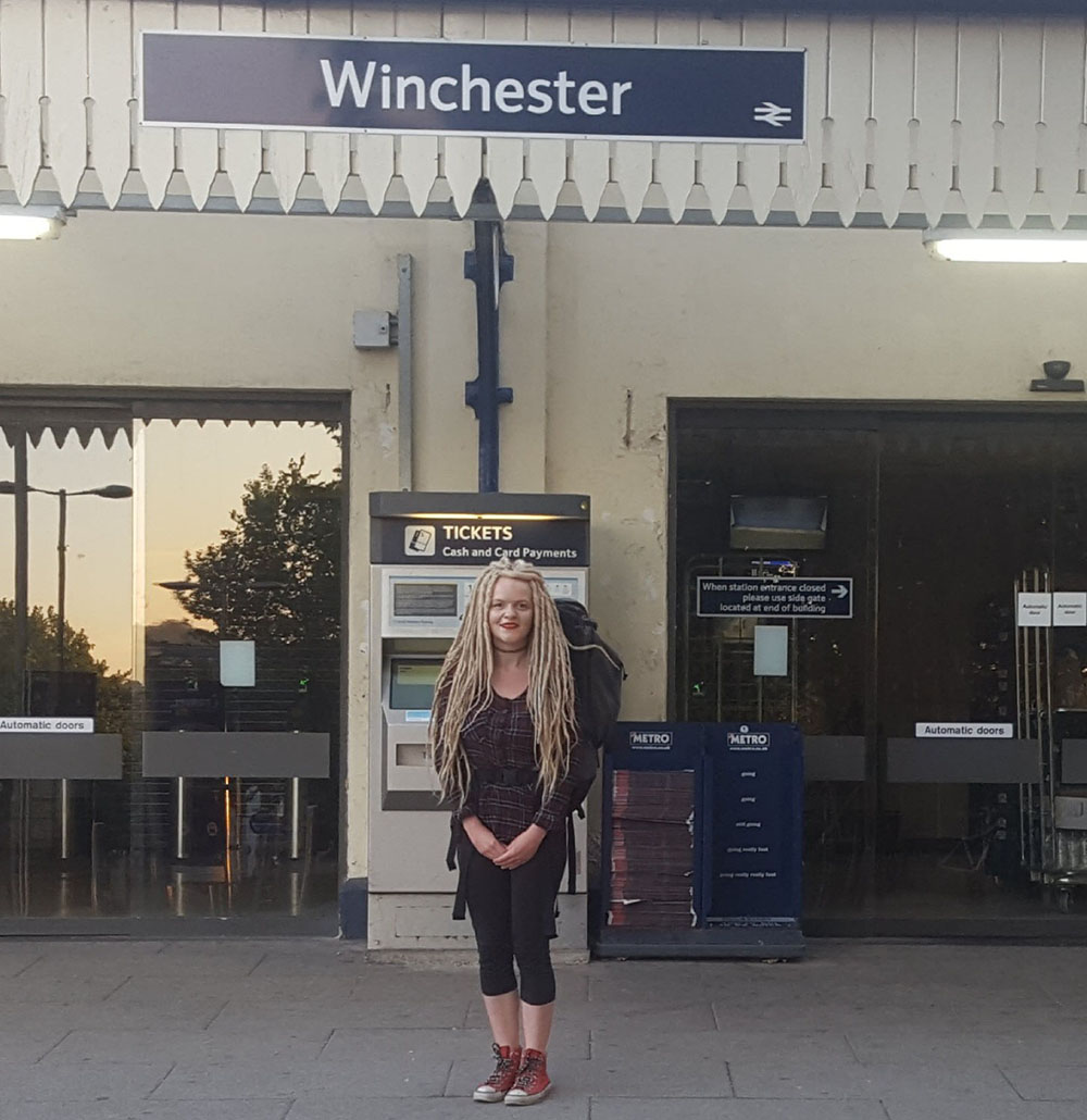 Student Sarah Buck stood with packed bag outside Winchester train station