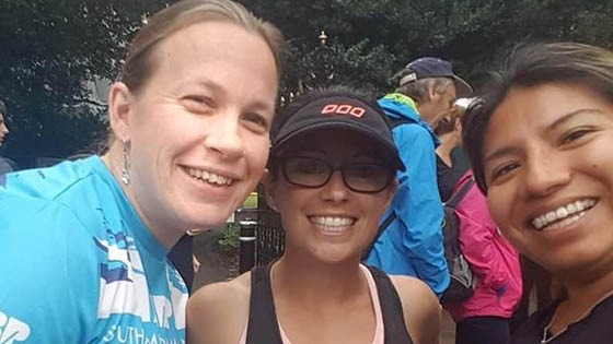 Vanessa Corbett pictured between two friends before starting Winchester half-marathon