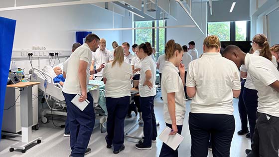 Physiotherapy students working together on the ward