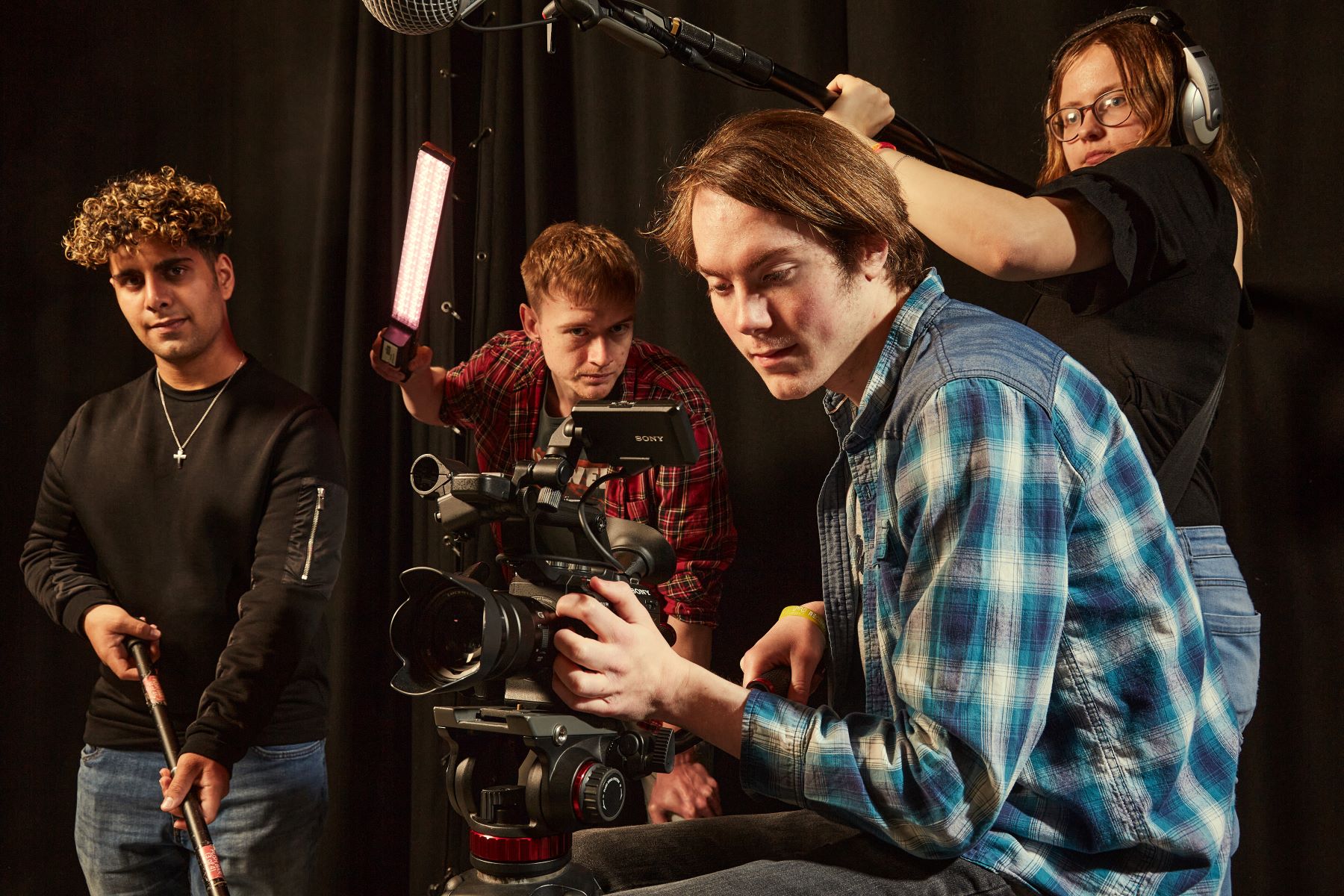 Film students with camera equipment