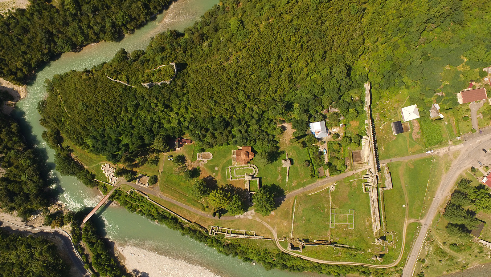 aerial view of an archaeological site by a river