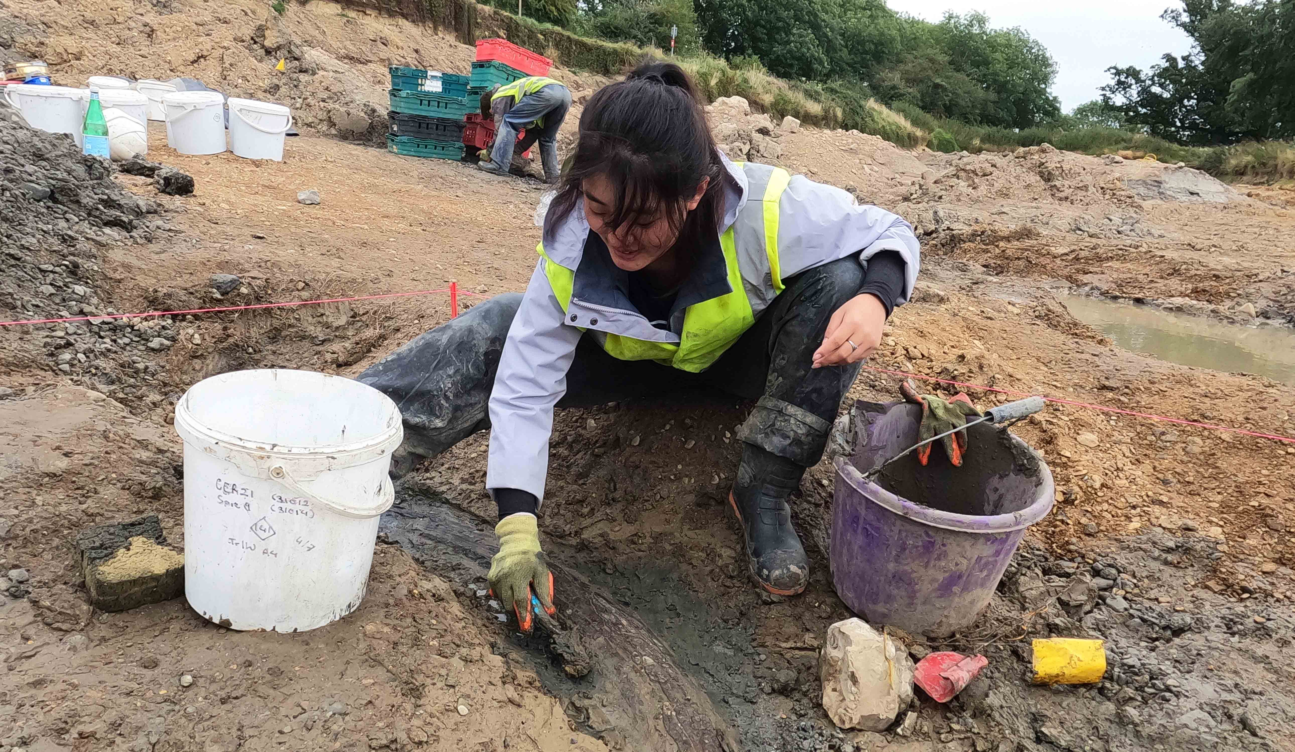 University of Winchester Archaeology student excavating a mammoth tusk