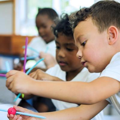 children learning through play in a classroom