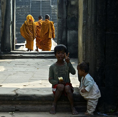 Centre for Religion, Reconciliation and Peace image of Asian monks and small boy making V-sign 