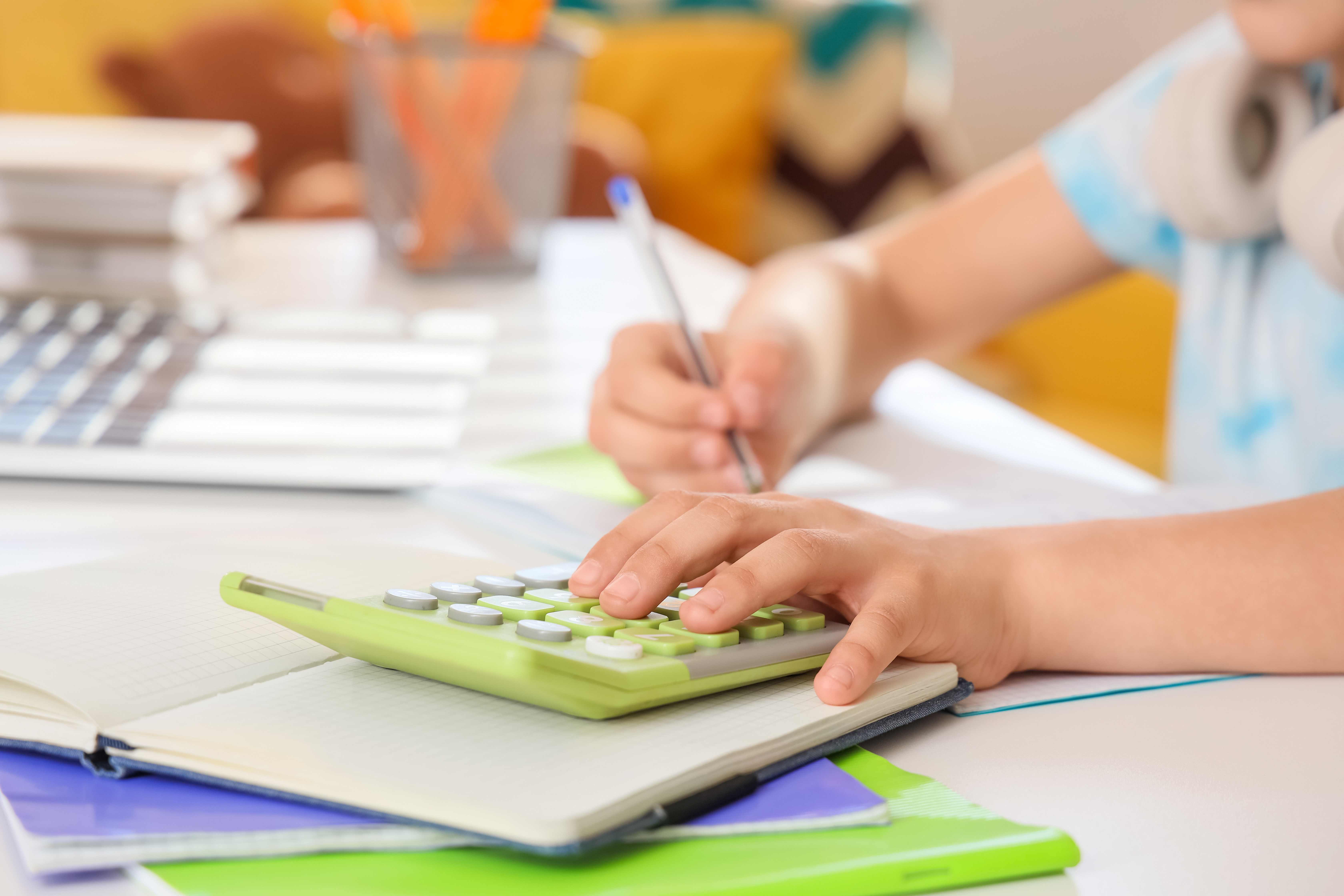 a young person using a calculator