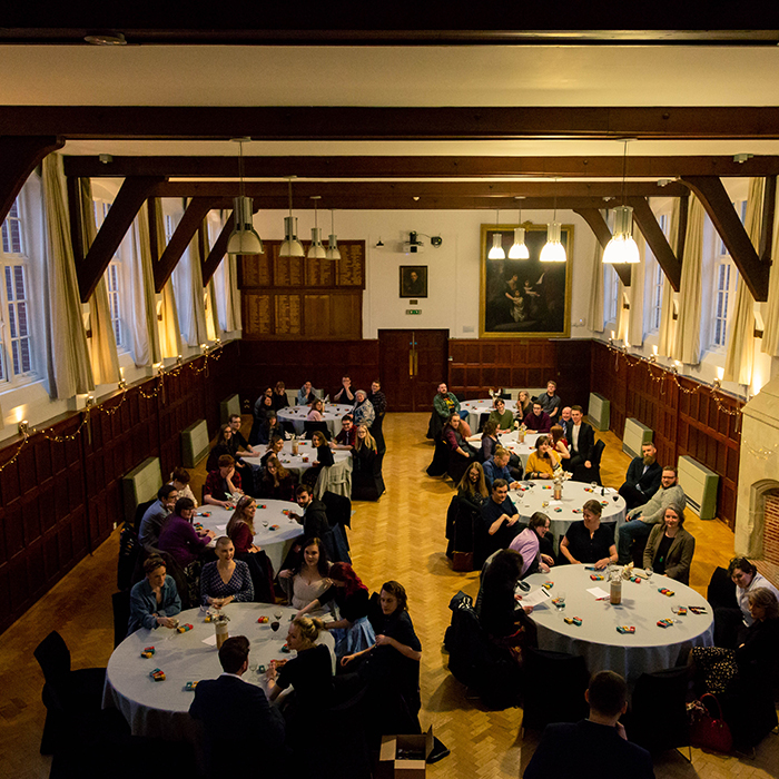 Large hall with guests sat at tables