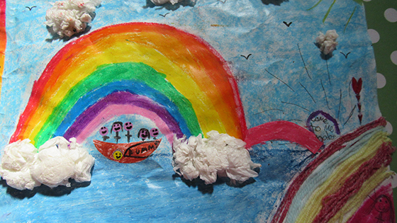 Child's drawing of rainbow and clouds