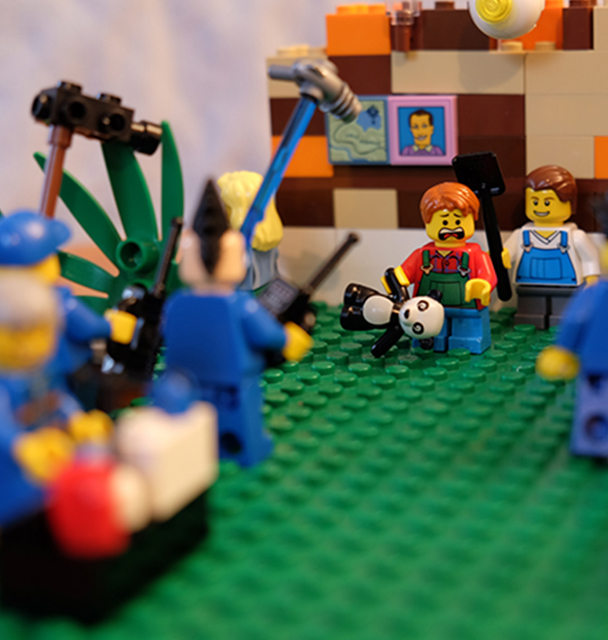 Lego scene of family being filmed for TV