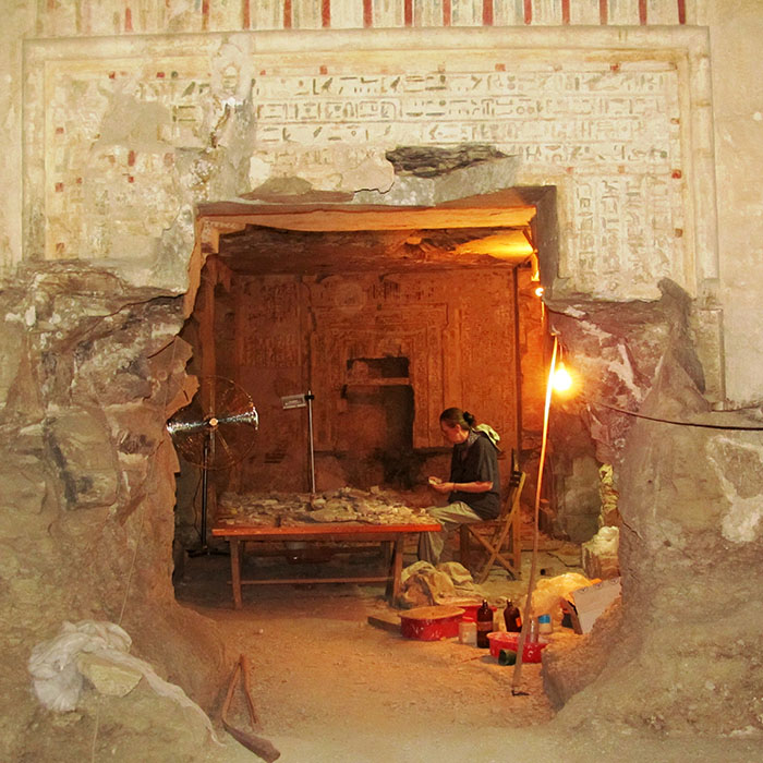 A lady doing research in ancient Egyptian building