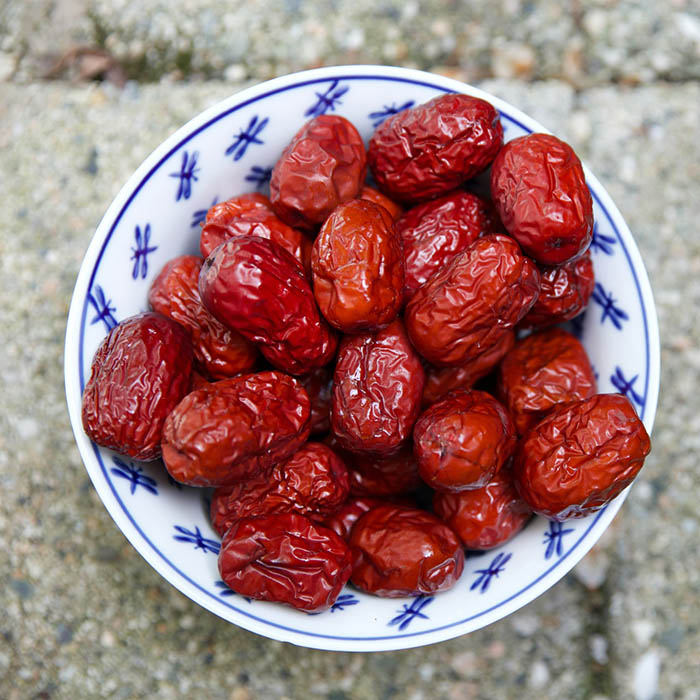 Dates in a blue and white ceramic bowl